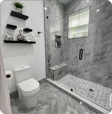 Comfortable office with plants, wooden desk, and two black chairs
